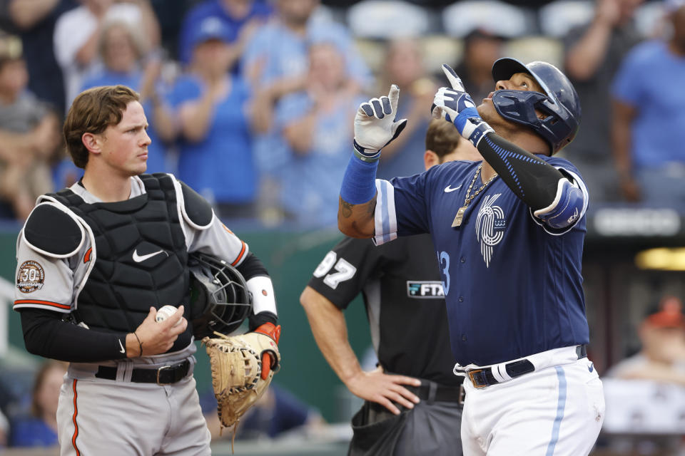Kansas City Royals' Salvador Perez, right, celebrates at home plate after hitting a two-run home run, next to Baltimore Orioles catcher Adley Rutschman during the first inning of a baseball game in Kansas City, Mo., Friday, June 10, 2022. (AP Photo/Colin E. Braley)