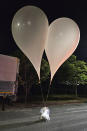 This photo provided by South Korea Defense Ministry, shows balloons with trash presumably sent by North Korea, in South Chungcheong Province, South Korea, Wednesday, May 29, 2024. In another sign of tensions between the war-divided rivals, South Korea's Joint Chiefs of Staff said North Korea also has been flying large numbers of balloons carrying trash toward the South since Tuesday night, in an apparent retaliation against South Korean activists for flying anti-Pyongyang propaganda leaflets across the border. (South Korea Presidential Office via AP)