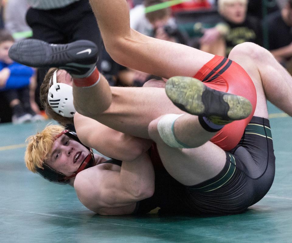 Brick Memorial's Harvey Ludington (bottom) defeated Mount Olive's Tyler Bienus 10-3 Wedneday in the 175-pound final of the Mustang Classic at Brick Memorial.