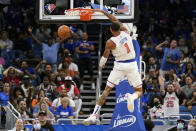 New York Knicks' Obi Toppin (1) makes an uncontested dunk after picking up a loose ball from an Orlando Magic turnover during the second half of an NBA basketball game Friday, Oct. 22, 2021, in Orlando, Fla. (AP Photo/John Raoux)