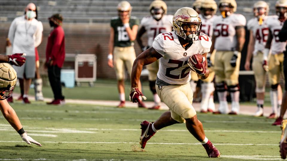 FSU running back/athlete Ja'Khi Douglas carries the ball during the Seminoles' practice August 18, 2020.