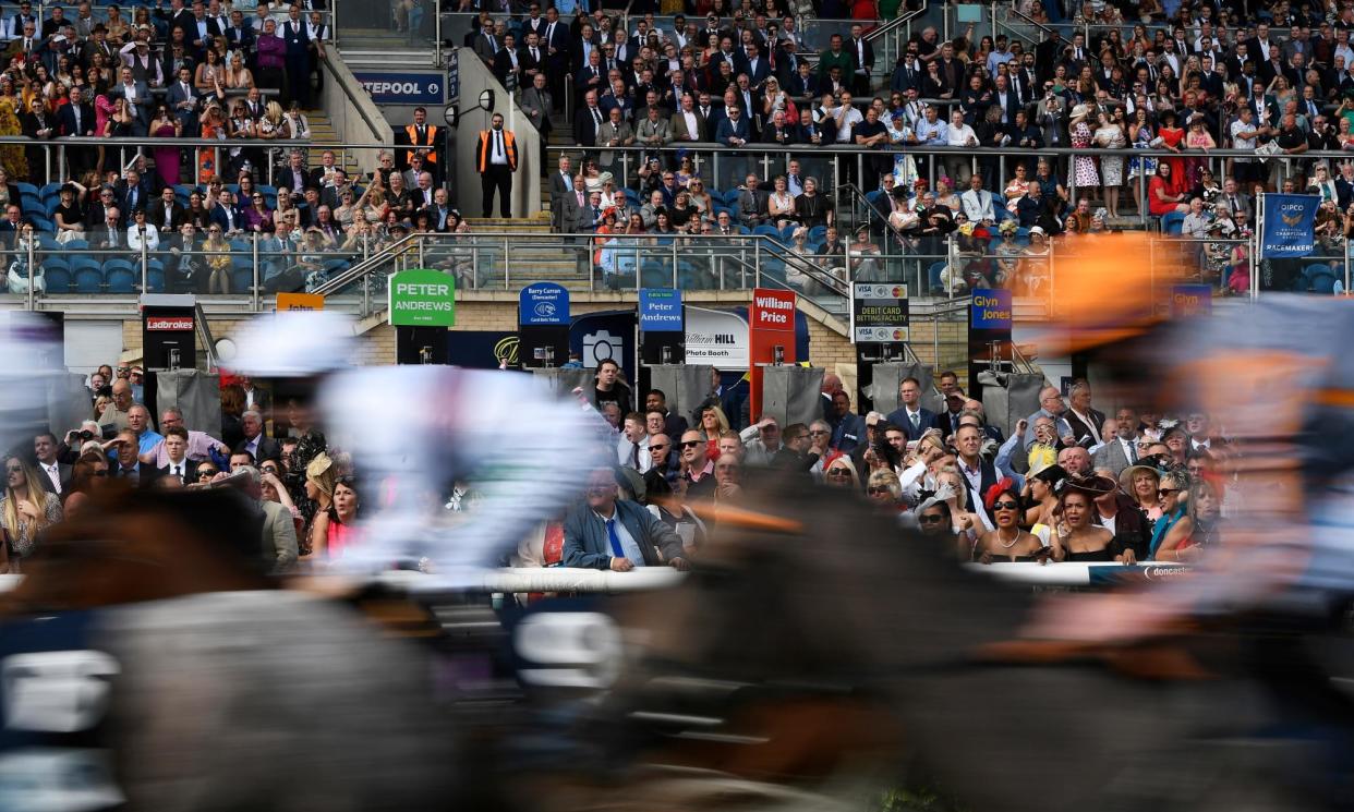 <span>Anxieties about a general smoking ban at racecourses involve the practicality of enforcement.</span><span>Photograph: George Wood/Getty Images</span>