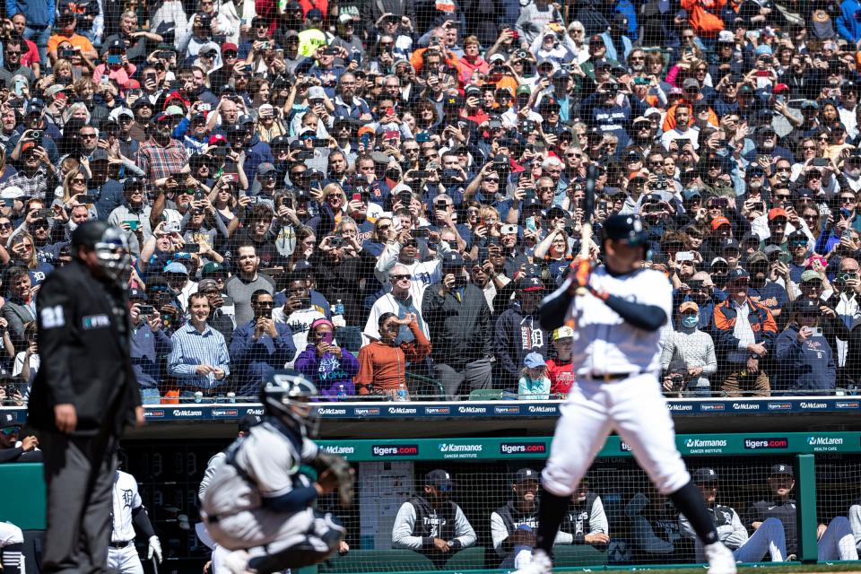 Tigers fans take photos and videos as they watch Miguel Cabrera bat against the Yankees during the fourth inning at Comerica Park on Thursday.