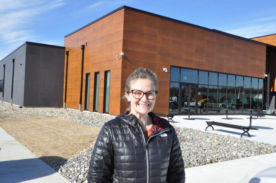 Kim Turner, Food Bank of Delaware communications director, stands outside the café, which is open to the public at the Food Bank's new Milford building. The Food Bank holds culinary classes for students who practice their skills at the café under the supervision of chefs.