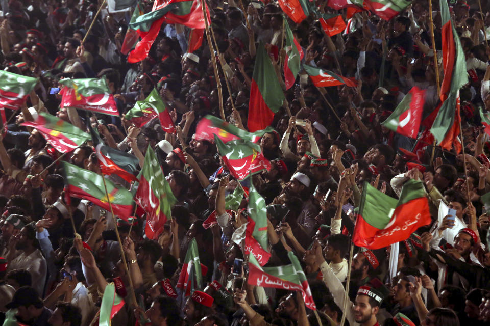 Supporters of Pakistani opposition leader Imran Khan's Tehreek-e-Insaf party attend a rally, in Peshawar, Pakistan, Tuesday, Sept. 6, 2022. Since he was toppled by parliament five months ago, former Prime Minister Imran Khan has demonstrated his popularity with rallies that have drawn huge crowds and signaled to his rivals that he remains a considerable political force. (AP Photo/Mohammad Sajjad)