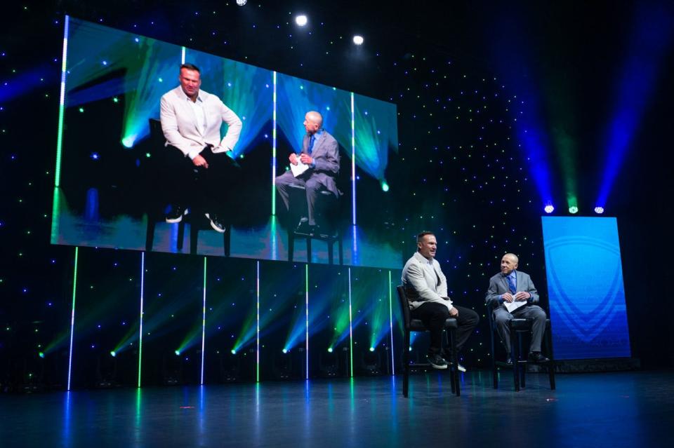 Former Miami Dolphins linebacker Zach Thomas speaks with Palm Beach Post sports writer Hal Habib during the Palm Beach Post High School Sports Awards ceremony at the Kravis Center in West Palm Beach, FL., on Wednesday, May 1, 2022.