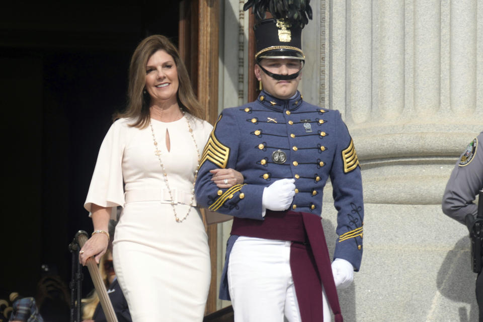 South Carolina Lt. Gov. Pamela Evette, left, is escorted to her seat at at the second inaugural ceremony for Gov. Henry McMaster on Wednesday, Jan. 11, 2023, in Columbia, S.C. (AP Photo/Meg Kinnard)