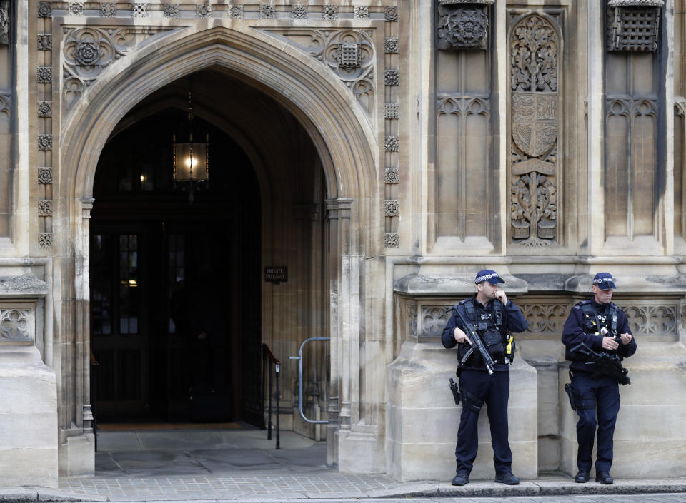 Armed police forces guard the entrance of the Houses of Parliament in London, Monday, Sept. 9, 2019. British Prime Minister Boris Johnson voiced optimism Monday that a new Brexit deal can be reached so Britain leaves the European Union by Oct. 31.(AP Photo/Frank Augstein)