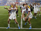 United States' Megan Rapinoe , left, celebrates with teammates their victory in the Women's World Cup final soccer match between US and The Netherlands at the Stade de Lyon in Decines, outside Lyon, France, Sunday, July 7, 2019. US won 2:0. (AP Photo/David Vincent)