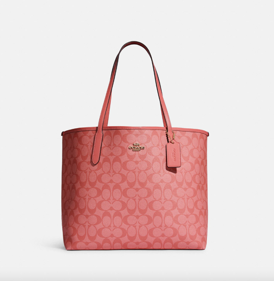 City Tote in Blocked Signature Canvas Gold/Pink Lemonade (Photo via Coach Outlet)