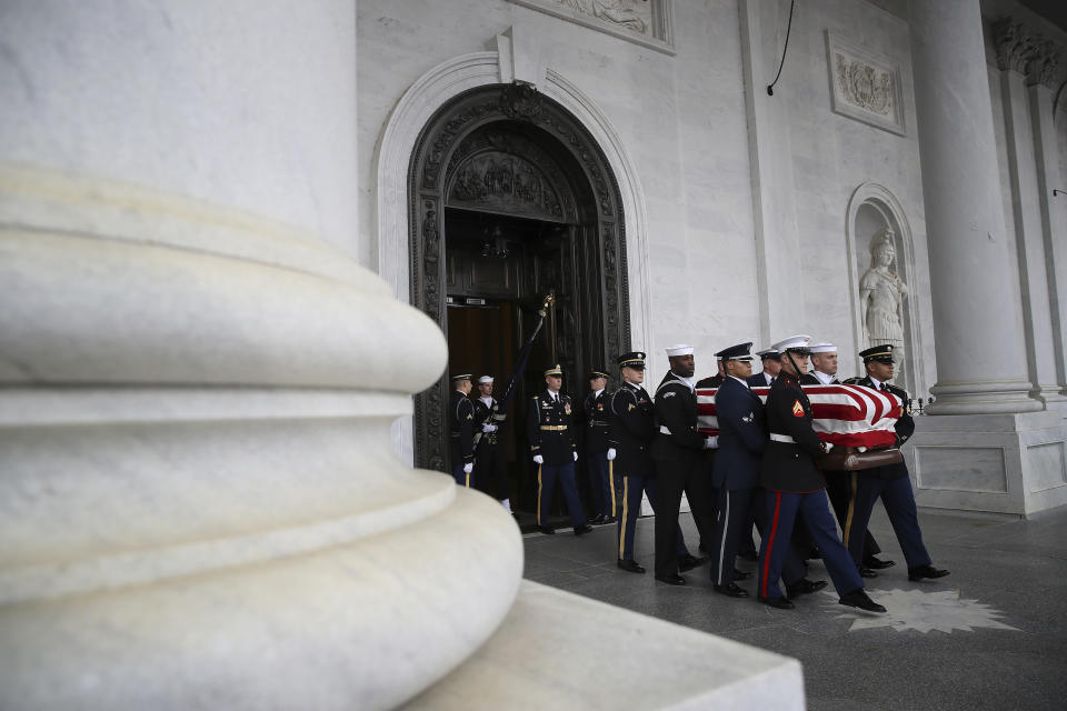 The flag-draped casket of former President George H. W. Bush is carried by a joint services military honor guard out of the Capitol, Wednesday, Dec. 5, 2018, in Washington. (Photo: Win McNamee/Pool via AP)