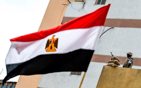 An Egyptian soldier stands on guard during the referendum - Credit: KHALED DESOUKI/AFP/Getty Images