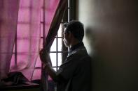 Rohingya refugee and activist Zafar Ahmad Abdul Ghani looks out from his home in Kuala Lumpur