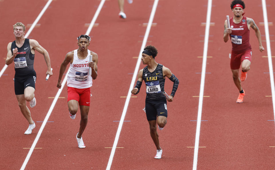 LSU's Terrance Laird, second from right, finishes the final leg of the men's 4x100 relay semifinals during the NCAA Division I Outdoor Track and Field Championships, Wednesday, June 9, 2021, at Hayward Field in Eugene, Ore. (AP Photo/Thomas Boyd)