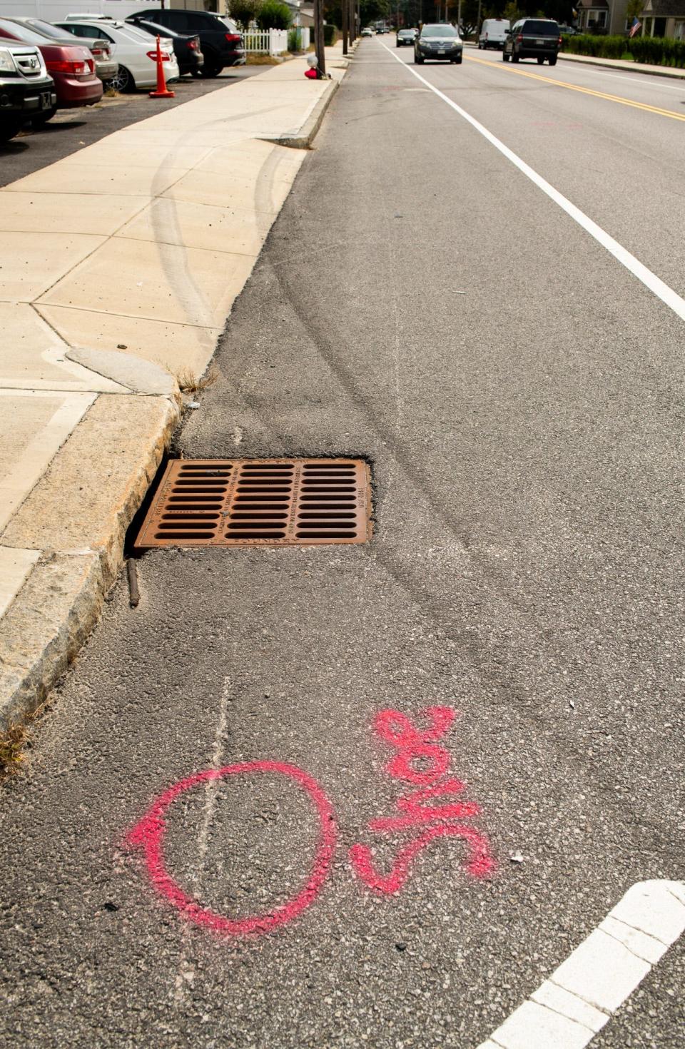 Spray paint marking evidence and tire skid marks show the site of an apparent fatal collision involving a pedestrian on South Ludlow Street near Clover Street Wednesday.