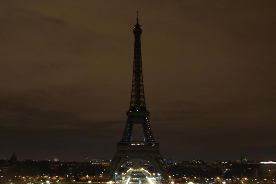 The Eiffel Tower goes dark as Paris shows support for London (AFP/Getty Images)