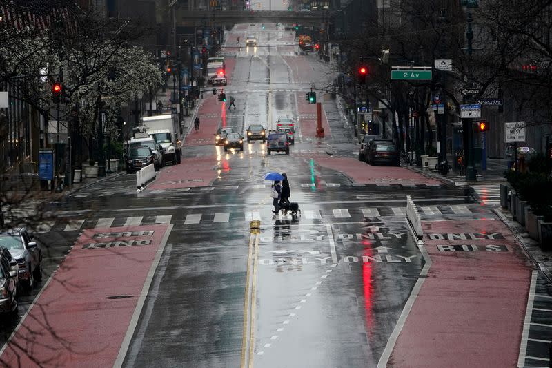 Person crosses a mostly deserted 42nd Street in Manhattan