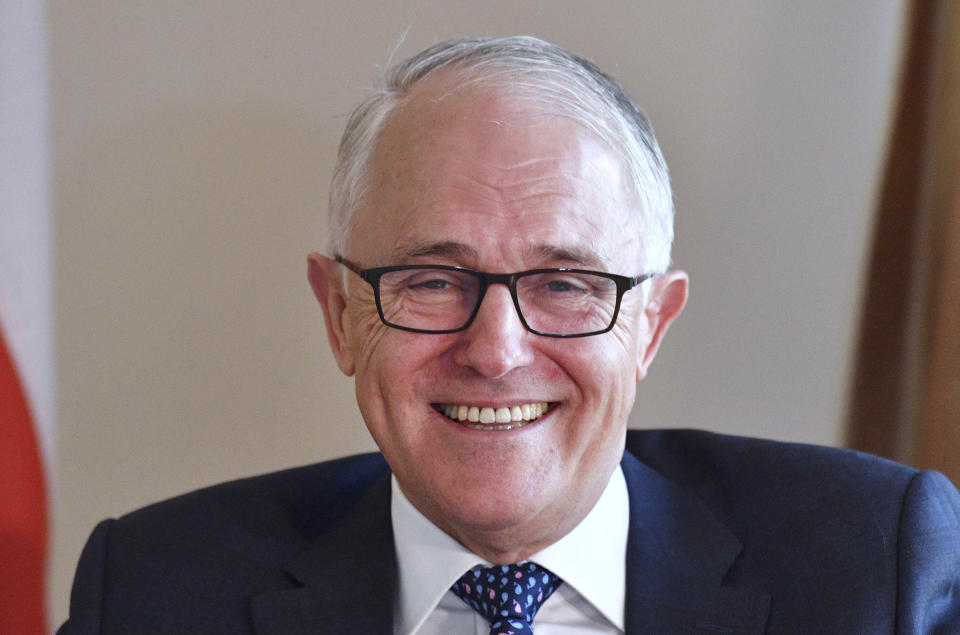 Australia's Prime Minister Malcolm Turnbull sits during a meeting with Poland's President Andrzej Duda at Parliament House in Canberra, Monday, Aug. 20, 2018. Turnbull abandoned plans to legislate to limit greenhouse gas emissions to head off a revolt by conservative lawmakers. (Mick Tsikas/Pool Photo via AP)