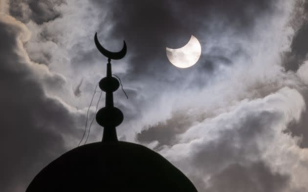 The partial solar eclipse is seen in Herzliya, Israel. (Photo: Nir Keidar/Anadolu Agency via Getty Images)