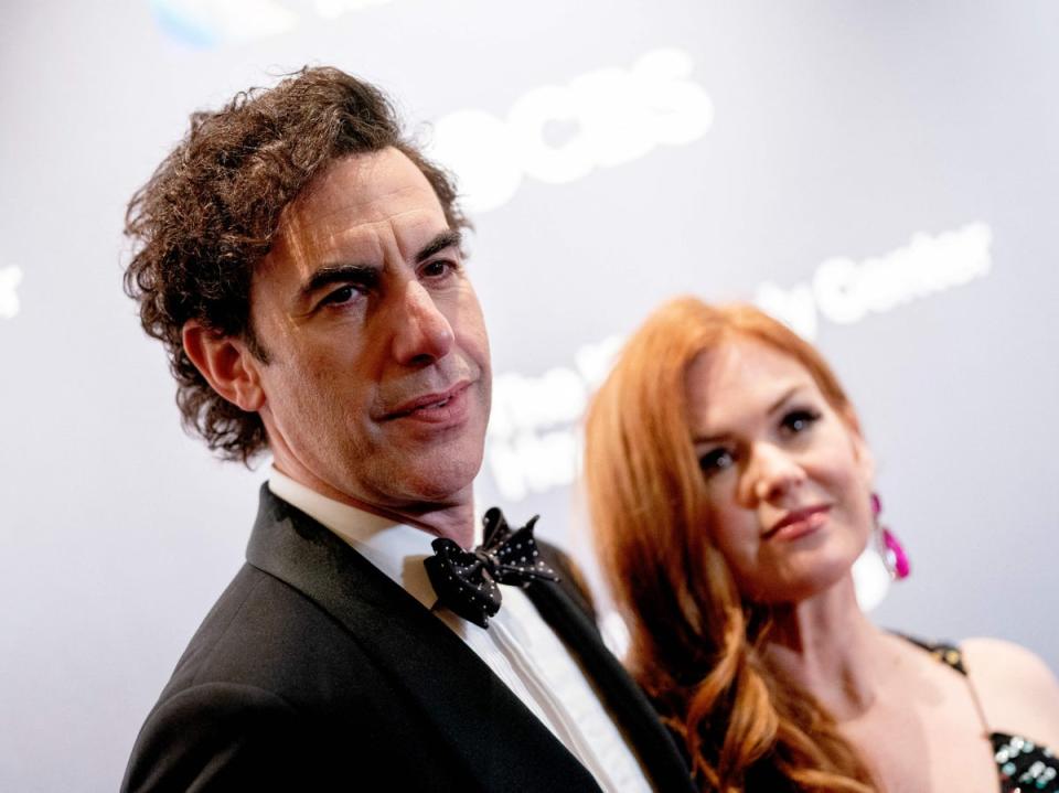 Sacha Baron Cohen and Isla Fisher (AFP via Getty Images)