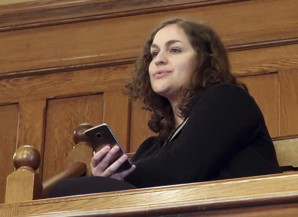 In this Wednesday, Feb. 13, 2019 photo, Rachel Sweet, a lobbyist for Planned Parenthood Great Plains, watches at the Kansas Senate debates a resolution condemning New York's new abortion law, at the Statehouse in Topeka, Kansas. She says, "I think this about political grandstanding." (AP Photo/John Hanna)