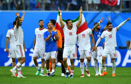 Soccer Football - World Cup - Group B - Morocco vs Iran - Saint Petersburg Stadium, Saint Petersburg, Russia - June 15, 2018 Iran's Reza Ghoochannejhad and team mates salute their fans after the match REUTERS/Dylan Martinez