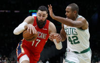 New Orleans Pelicans center Jonas Valanciunas (17) drives against Boston Celtics center Al Horford (42) during the first half of an NBA basketball game, Monday, Jan. 17, 2022, in Boston. (AP Photo/Mary Schwalm)