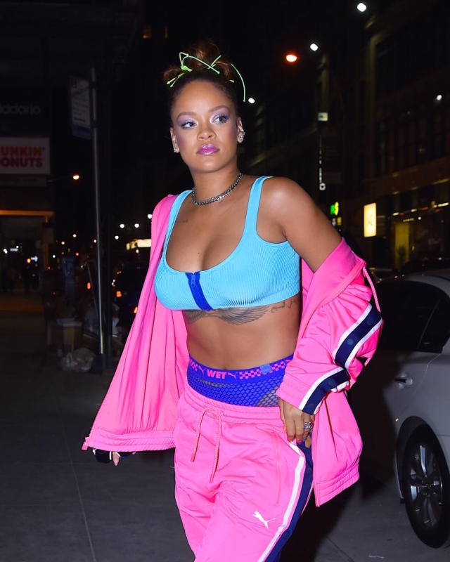 Rihanna's fishnet and sports bra combo at NYFW has us dreaming in DayGlo