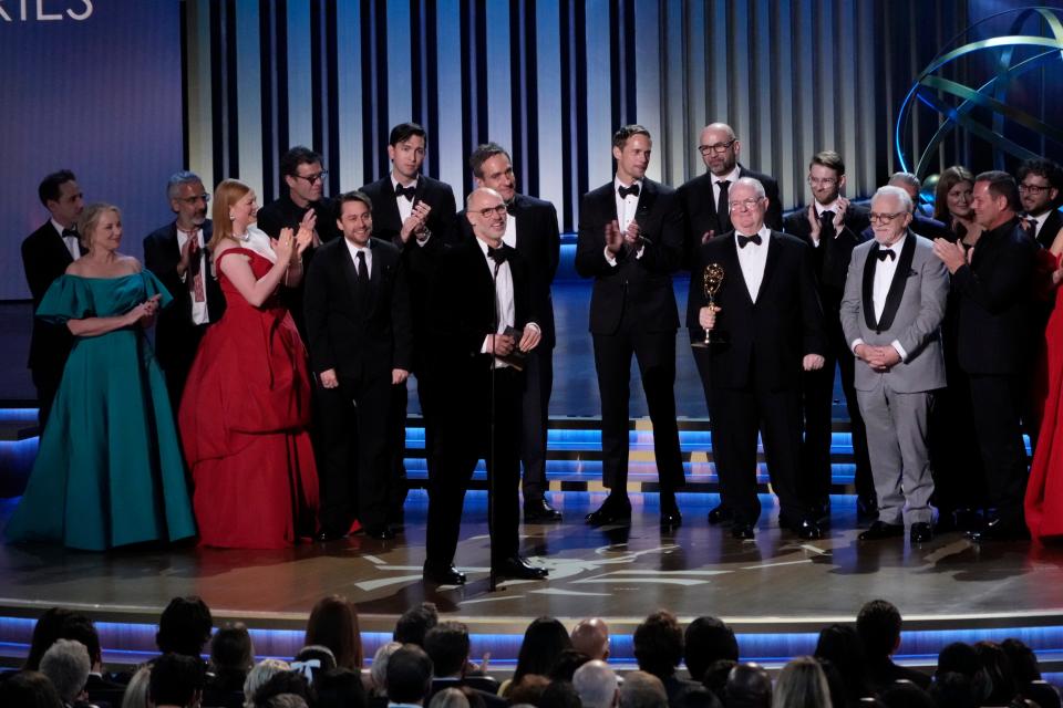 Jesse Armstrong accepts the award for best drama series for ‘Succession’ with the case and crew during the 75th Emmy Awards.