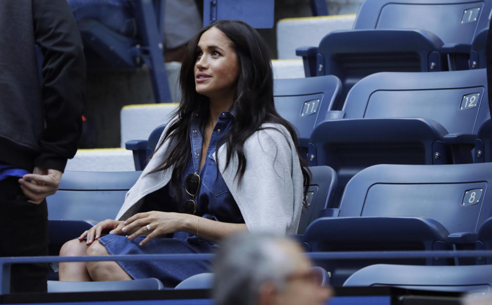 Meghan, Duchess of Sussex, waits for the start of the women's singles final of the U.S. Open tennis championships between Serena Williams, of the United States, and Bianca Andreescu, of Canada, Saturday, Sept. 7, 2019, in New York. (AP Photo/Adam Hunger)