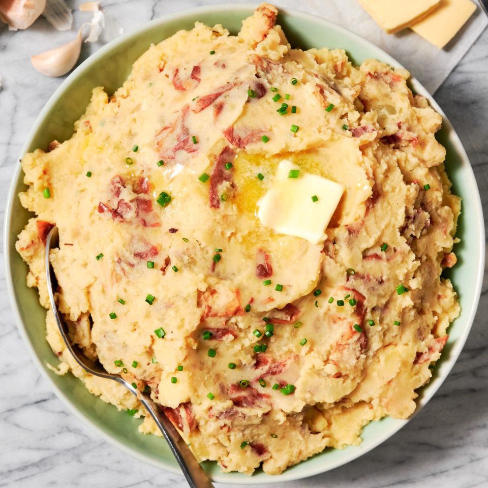 mashed potatoes in a crockpot with garlic and butter