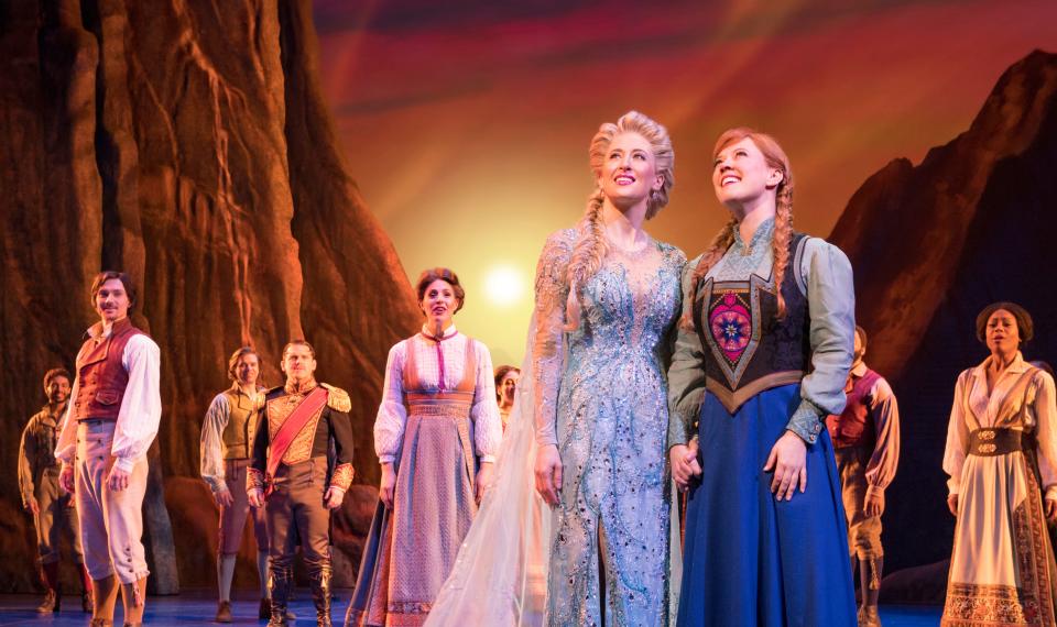 Caissie Levy as Elsa (left) and Patti Murin as Anna, with the company of "Frozen" on Broadway.