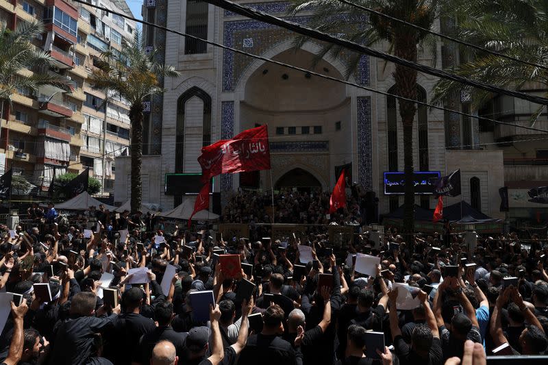 Lebanese Muslims participate in a demonstration called by the Shi'ite group Hezbollah to condemn the desecration of the Koran in Sweden, in Beirut