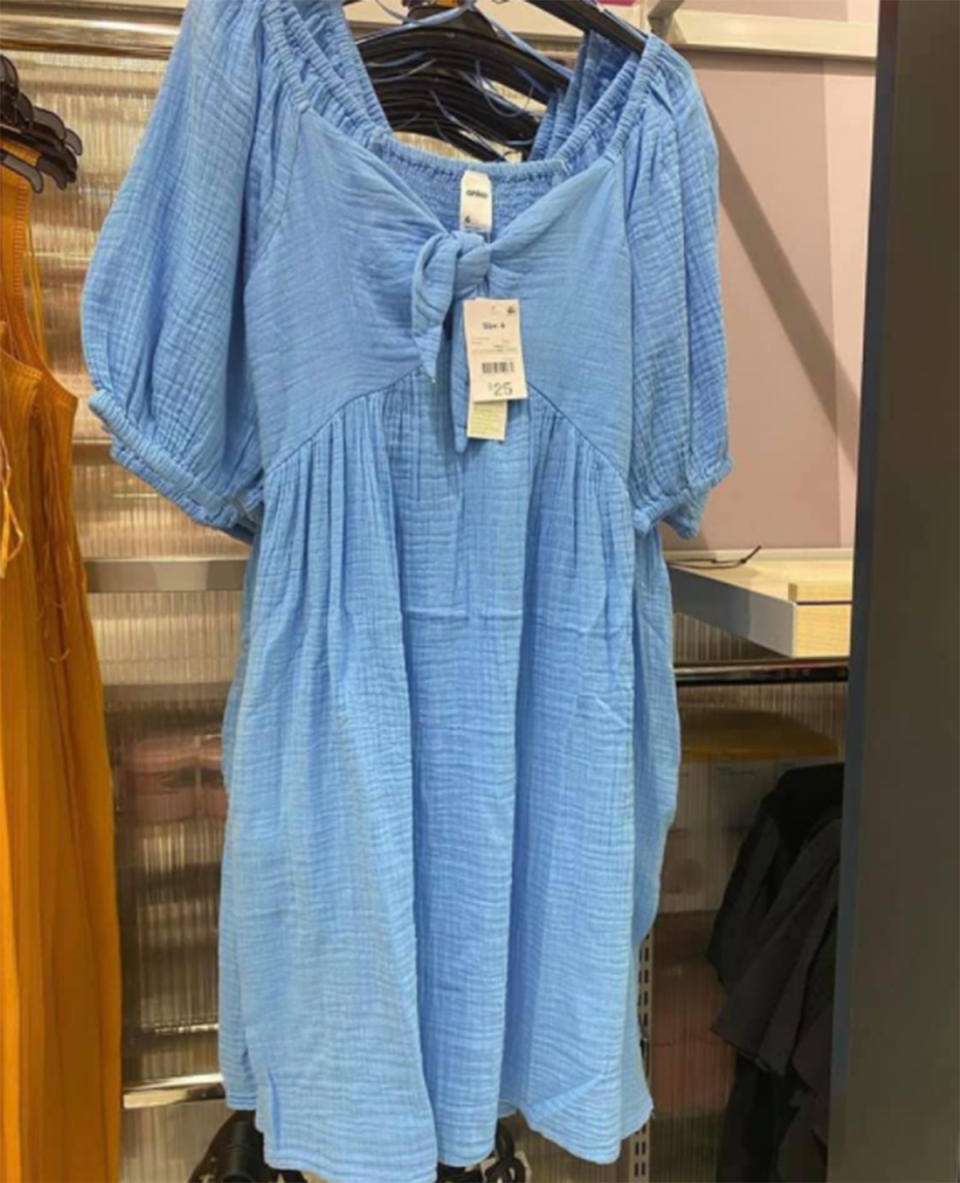 Kmart Short Sleeve Tie Front blue Dress hanging on rack in store