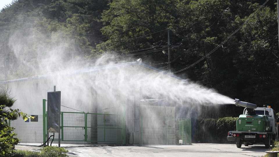 Disinfectant solution is sprayed as a precaution against African swine fever at a pig farm in Yanggu, South Korea, Tuesday, Sept. 17, 2019. South Korea is culling thousands of pigs after confirming African swine fever at a farm near its border with North Korea, which had an outbreak in May. (Yang Ji-ung/Yonhap via AP)