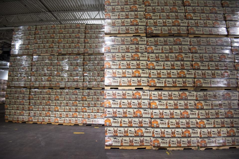 Cases of Dogfish Head's Punkin Ale four-packs await shipment at Dogfish Head Brewery in Milton last year.