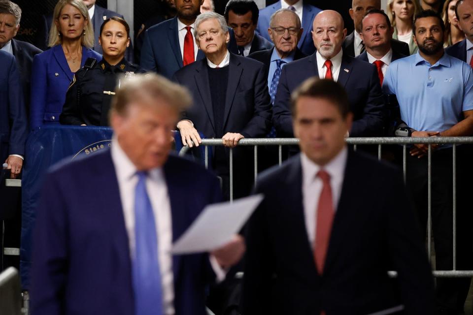 Donald Trump’s allies watch Donald Trump and his attorney Todd Blanche address reporters at his criminal trial in Manhattan on May 20. (AP)