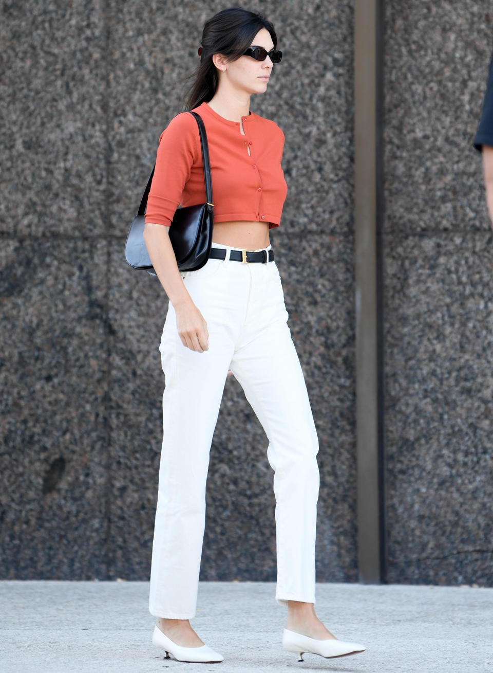 <p>Kendall Jenner sports a crop top and white slacks for a visit to the salon on July 19 in L.A. </p>