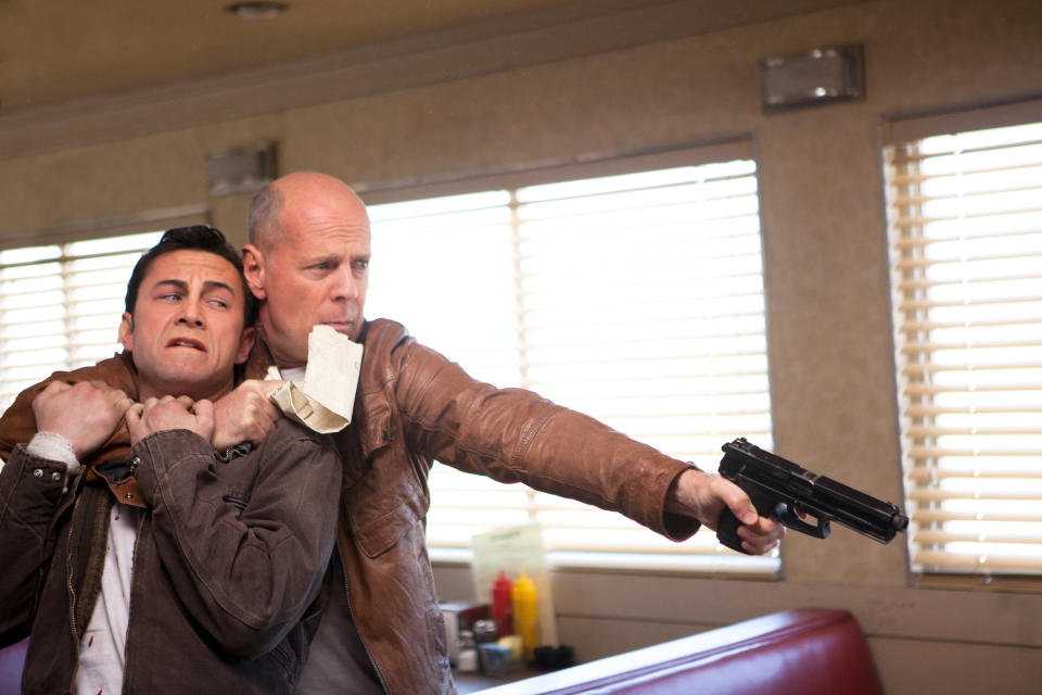 Joseph Gordon-Levitt and Bruce Willis share an intense moment in "Looper"