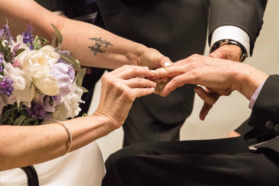 Matt and Sara exchange rings on their wedding day