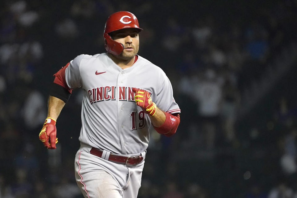 Cincinnati Reds' Joey Votto rounds the bases after hitting a two-run home run off Chicago Cubs relief pitcher Cory Abbott during the ninth inning of a baseball game Wednesday, July 28, 2021, in Chicago. (AP Photo/Charles Rex Arbogast)