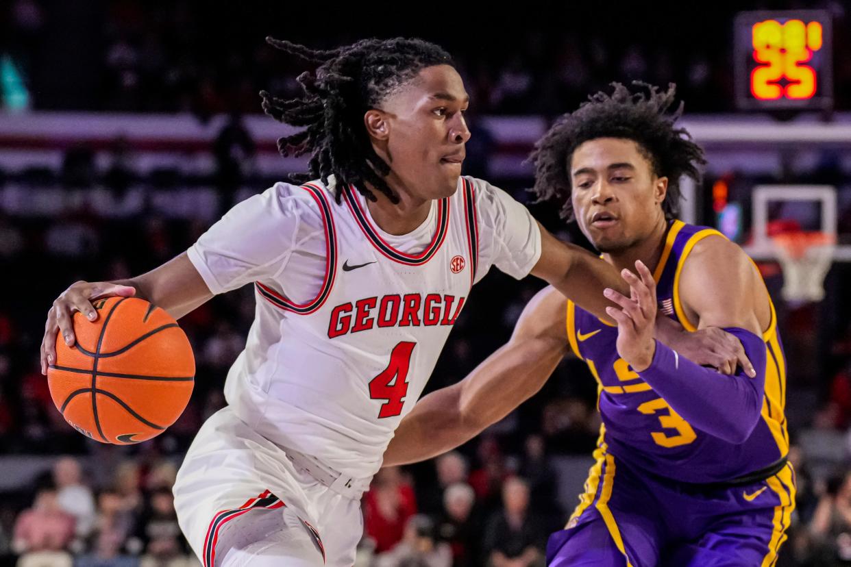 Jan 24, 2024; Athens, Georgia, USA; Georgia Bulldogs guard Silas Demary Jr. (4) dribbles against LSU Tigers guard Jalen Cook (3) during the first half at Stegeman Coliseum. Mandatory Credit: Dale Zanine-USA TODAY Sports