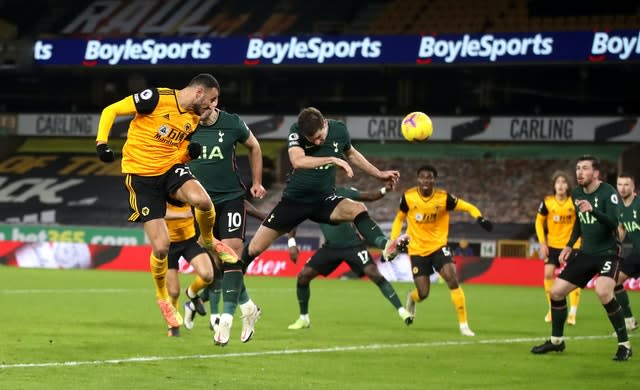 Romain Saiss (left) heads home the Wolves equaliser