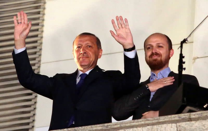FILE PHOTO: Turkish Prime Minister Tayyip Erdogan, accompanied by his son Bilal, greets his supporters in Ankara