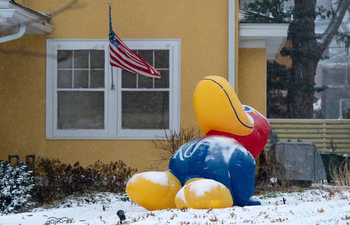 An inflatable KU Jayhawk inflatable is weighed down by snow on Thursday, Dec. 22, 2022, in Kansas City.