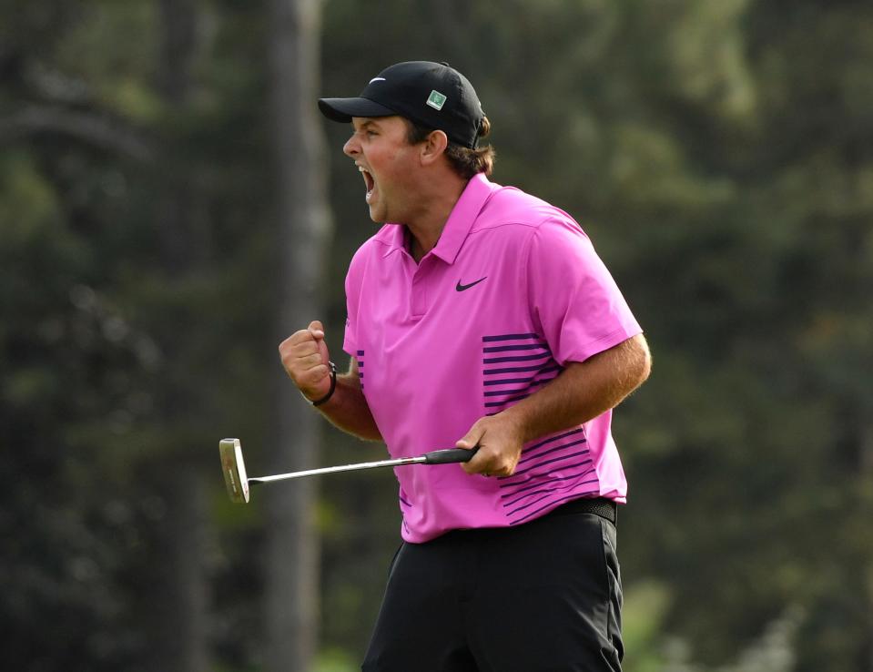 Patrick Reed celebrates after making a putt on the 18th green to win the Masters at Augusta National Golf Club on April 8, 2018.