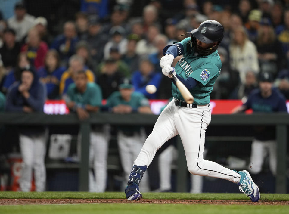 Seattle Mariners' J.P. Crawford hits a three-run double against the Houston Astros during the eighth inning of a baseball game Saturday, May 6, 2023, in Seattle. (AP Photo/Lindsey Wasson)