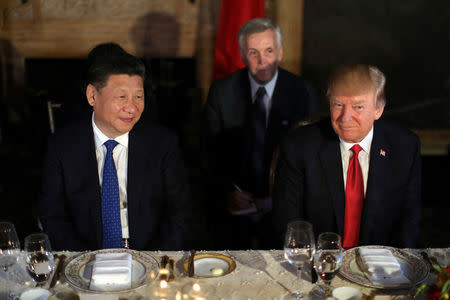 Chinese President Xi Jinping and President Donald Trump attend a dinner at the start of their summit at Trump's Mar-a-Lago estate in West Palm Beach, Florida. REUTERS/Carlos Barria