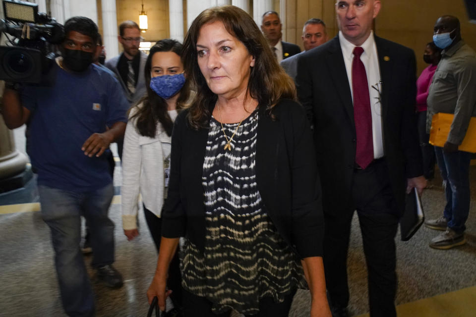Darlene Altman, daughter of Diane Cusick, leave court after the arraignment of Richard Cottingham, Wednesday, June 22, 2022, in Mineola, N.Y. More than 50 years after a woman was found dead in her car at a mall on Long Island, authorities prosecutors are expected to announce that DNA evidence has linked the slaying to Richard Cottingham, a serial killer who has been connected to 11 murders in New York and New Jersey between 1965 and 1980. (AP Photo/Mary Altaffer)