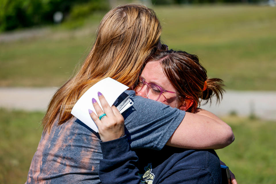 Ashleigh Webster hugs family friend Shannon Dillon at her home in Henryetta, Okla., on May 2, 2023. (Nathan J. Fish / The Oklahoman via USA TODAY Network)